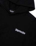 Sweat à capuche noir avec logo blanc Jägermeister sur la poitrine.