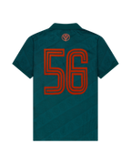 Maillot vert Jägermeister avec un « 56 » orange dans le dos.
