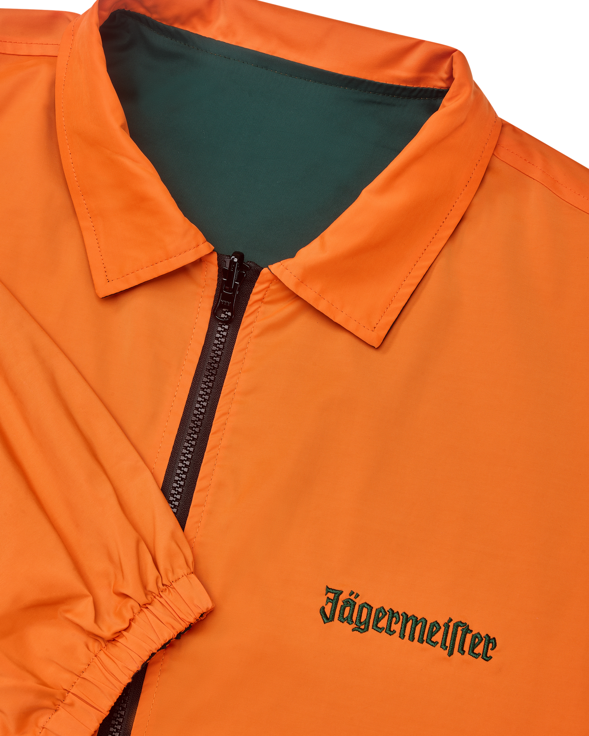 Close-up of the reversible Jägermeister jacket with a zipper showing the orange side