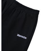 Black pants with white Jägermeister logo on the front.