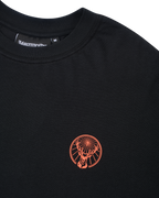 Black t-shirt with an orange Jägermeister logo.