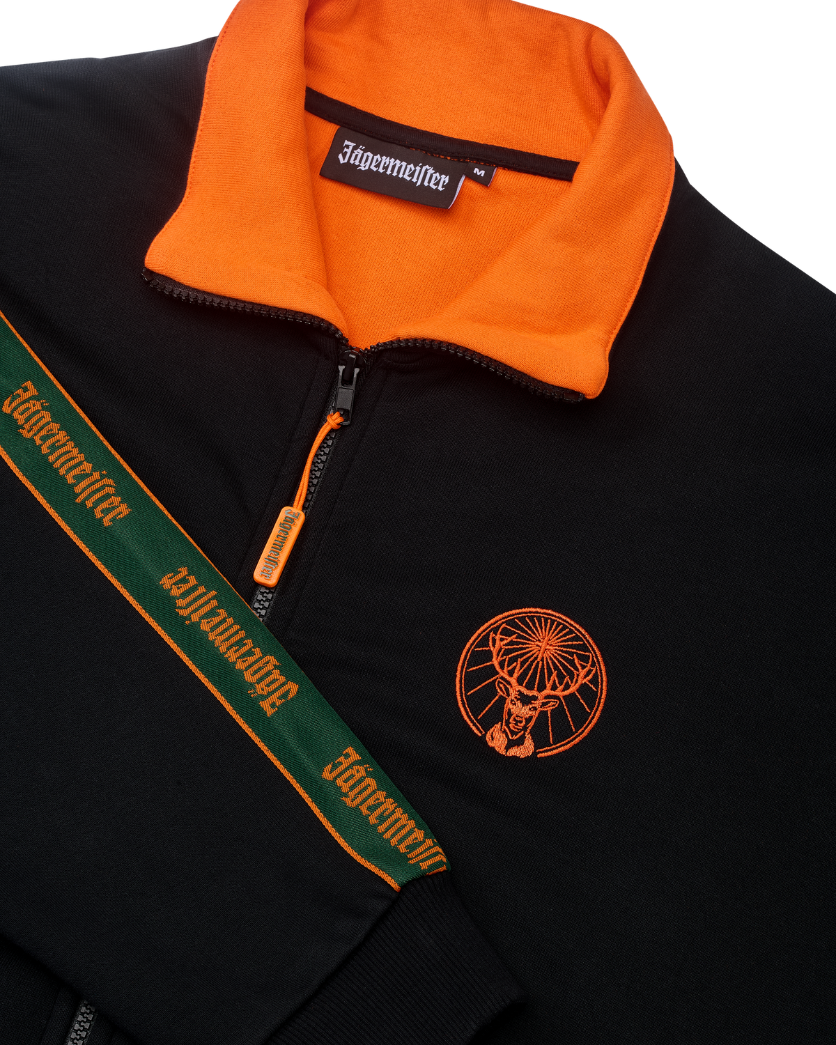 Black jacket with orange collar and Jägermeister branding on the chest and the sleeve.