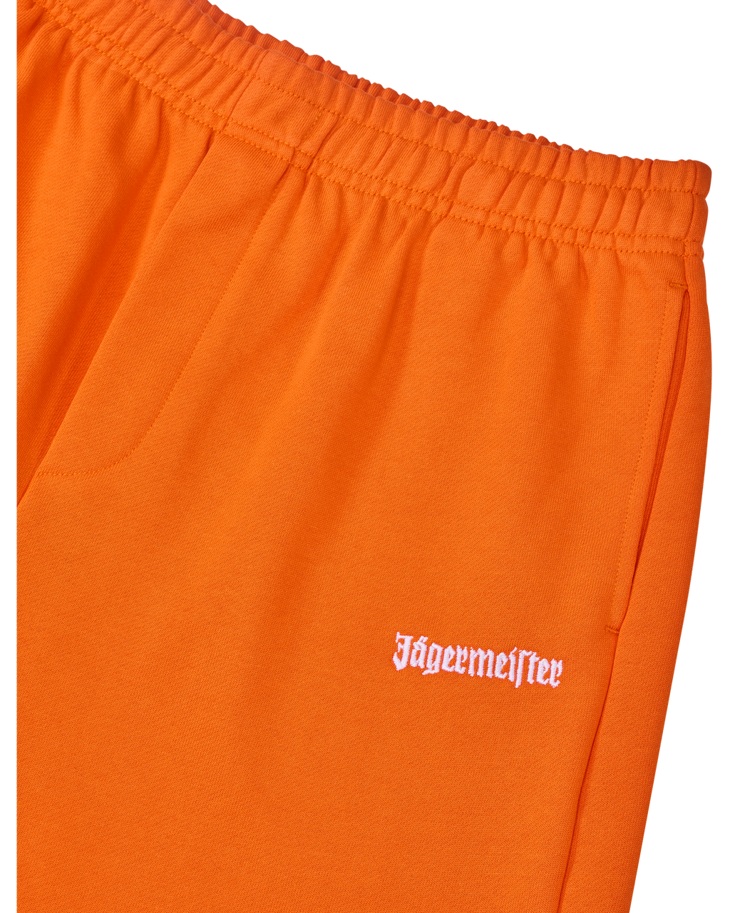 Orange track pants with white Jägermeister logo on the side.